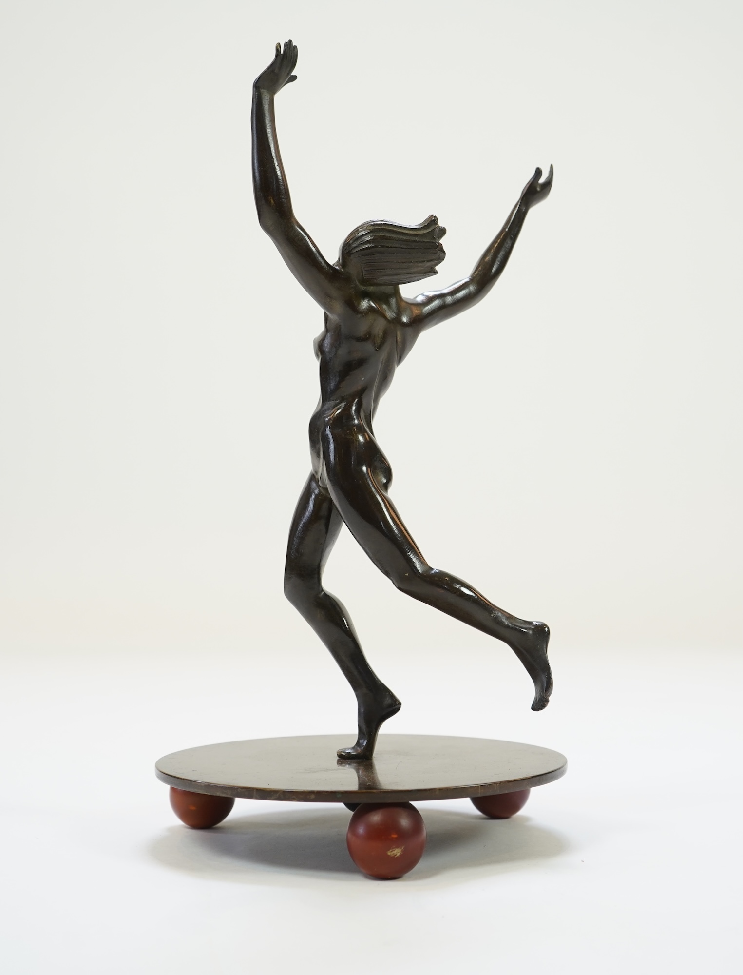 An Art Deco Austrian patinated bronze of a nude female dancer in the manner of Otto Hafenrichter